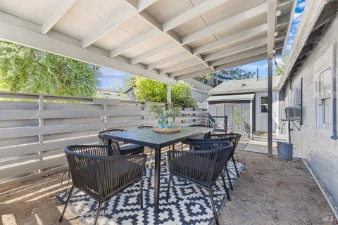a view of a tables and chairs in patio
