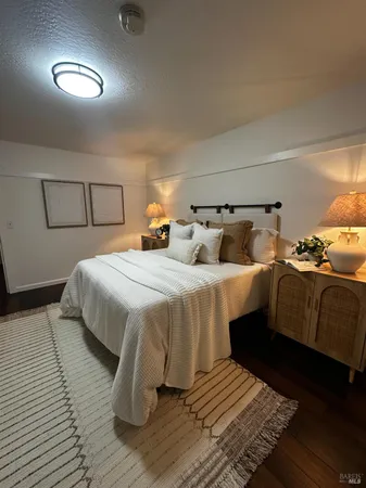 a bedroom with double bed and a night stand