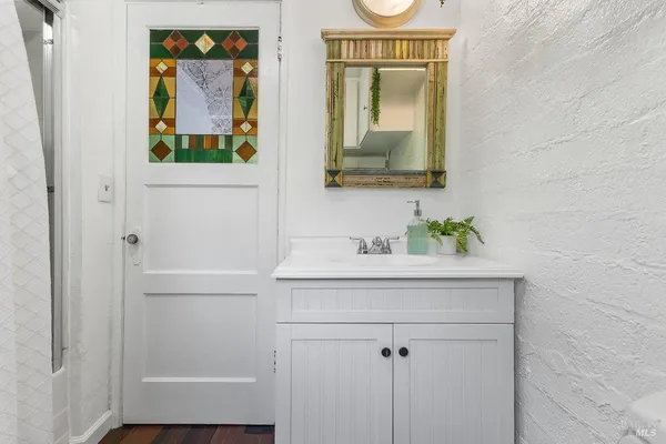a bathroom with a sink and a mirror