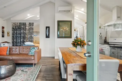 a living room with furniture and a table
