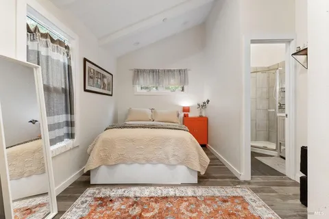 a bed room with a bed and a couch