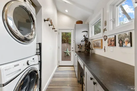 a view of a kitchen with washer and dryer