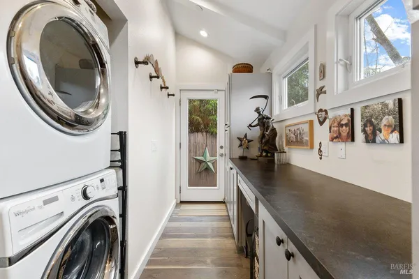 a view of a kitchen with washer and dryer