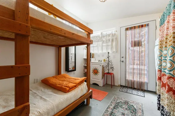 a bedroom with a bed and a table