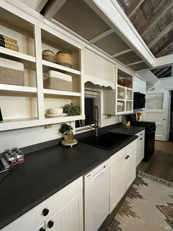 a kitchen with a sink and cabinets