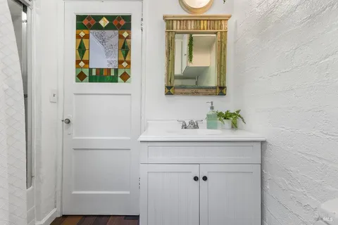 a bathroom with a sink and a mirror