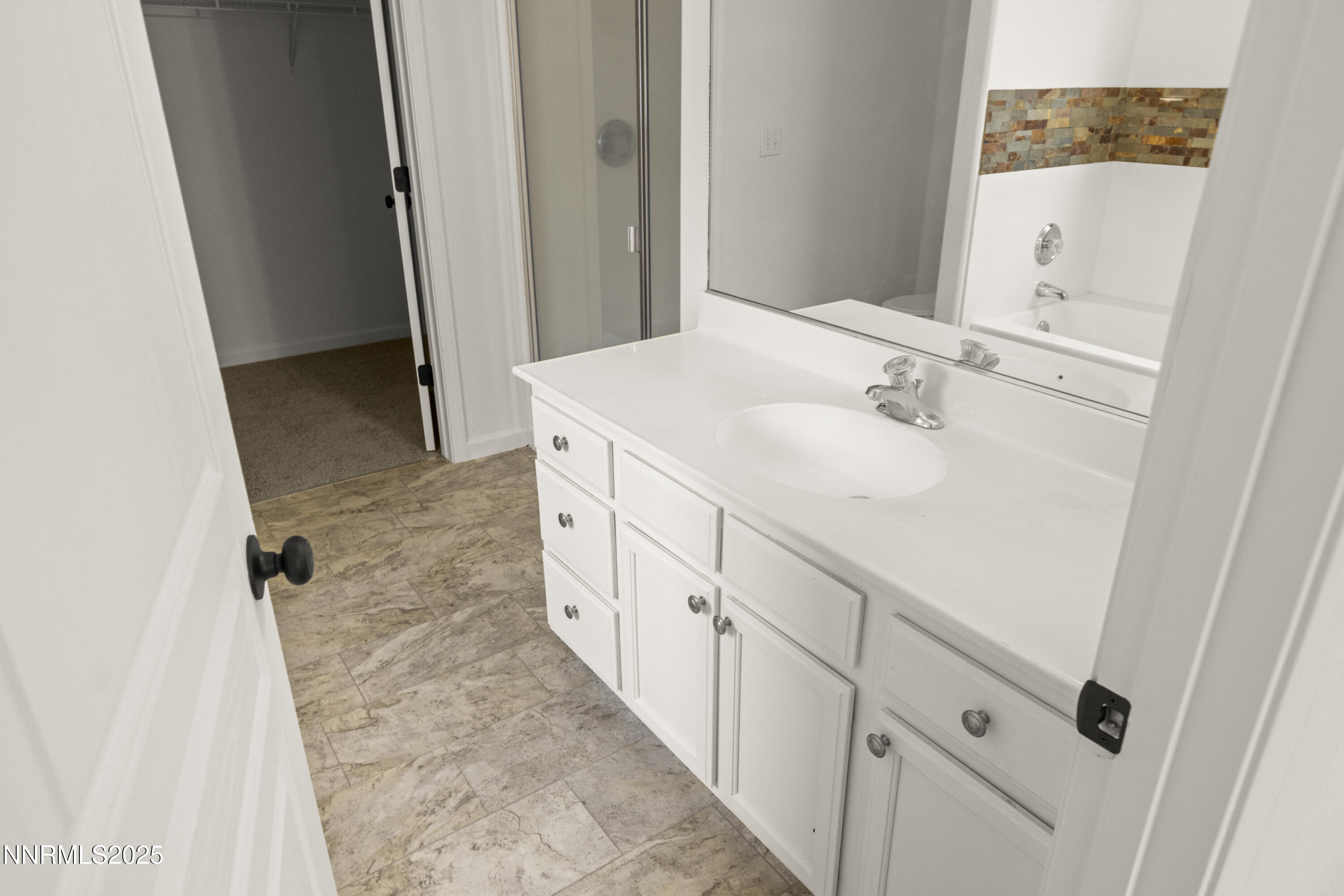 1418 Red Bluffs Way Fernley, NV 89408 - Photo 19 of 35 a bathroom with a sink and mirror