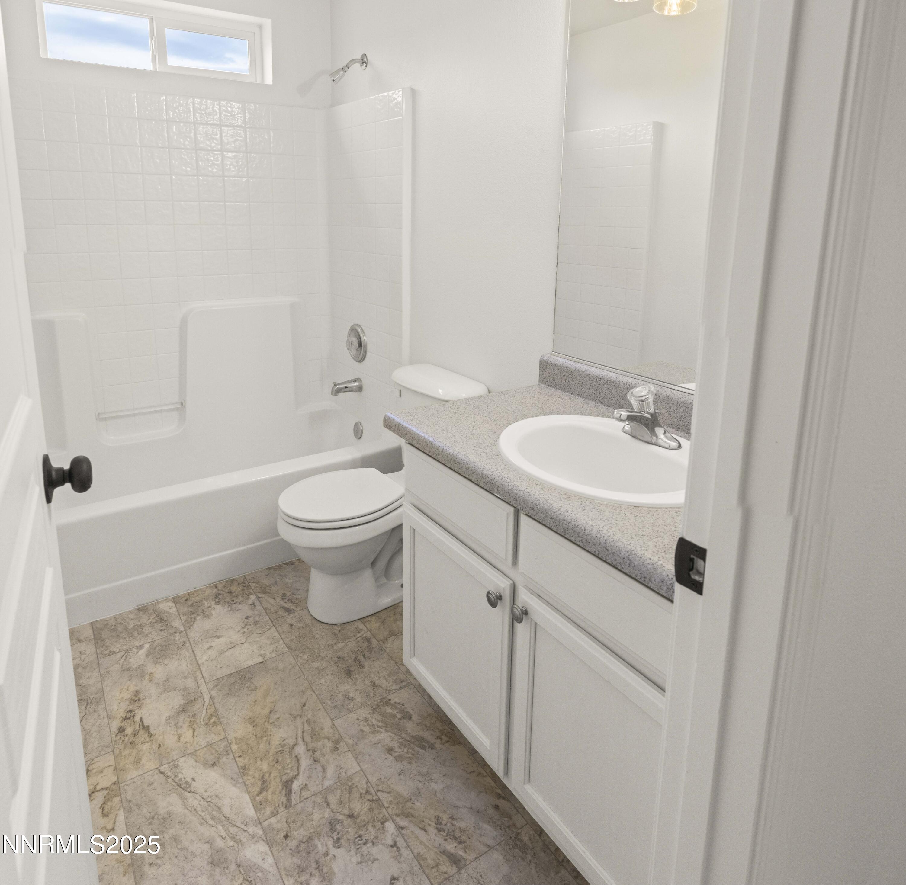 1418 Red Bluffs Way Fernley, NV 89408 - Photo 20 of 35 a bathroom with a sink a toilet and shower