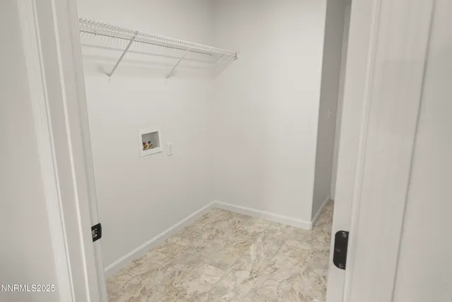 a front view of a house with a road