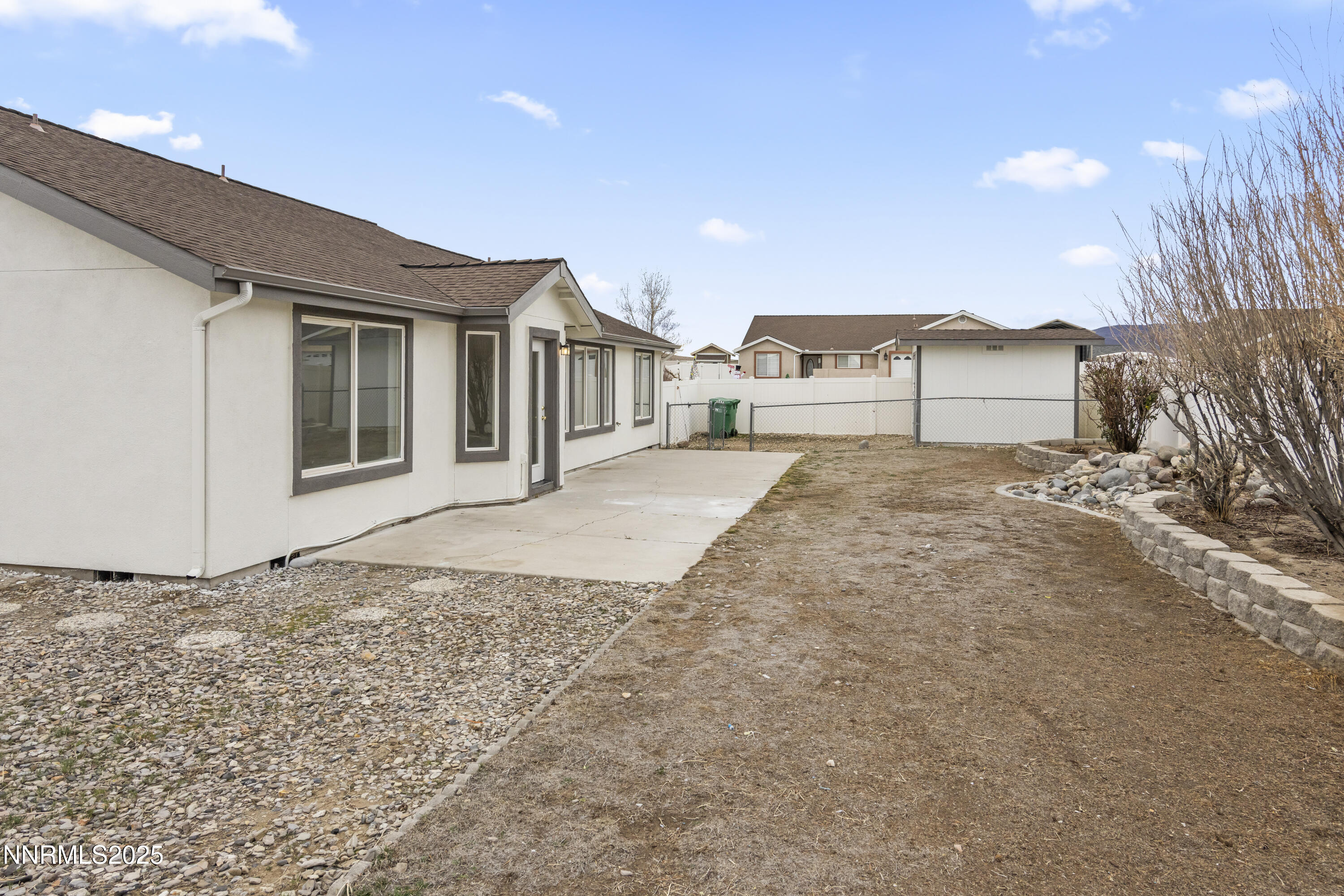 1418 Red Bluffs Way Fernley, NV 89408 - Photo 28 of 35 a view of a house with a snow in the yard
