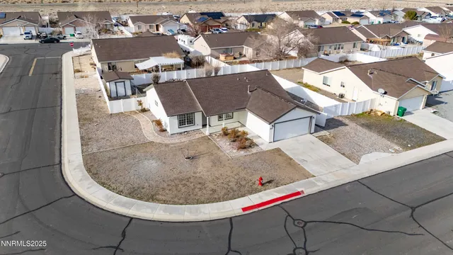 an aerial view of a highlighted house