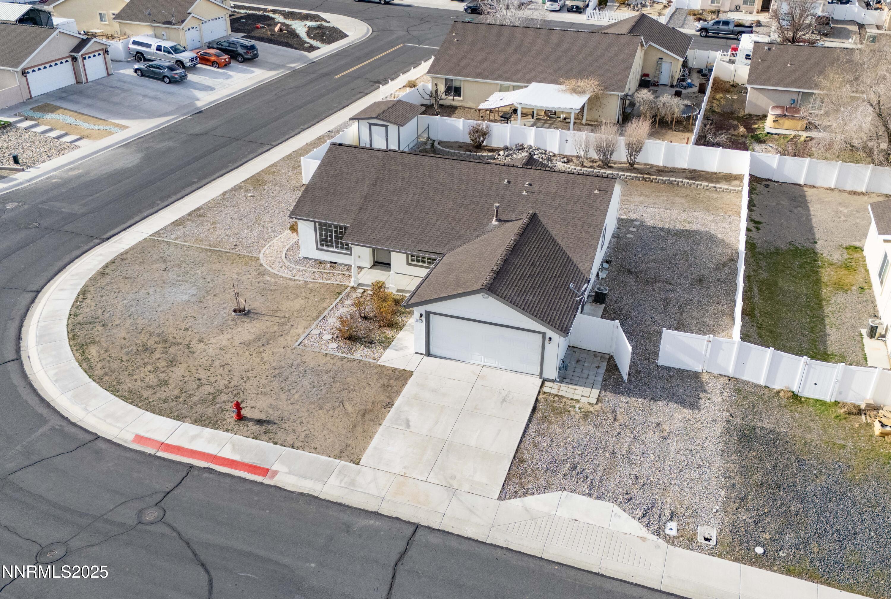1418 Red Bluffs Way Fernley, NV 89408 - Photo 34 of 35 an aerial view of a highlighted house