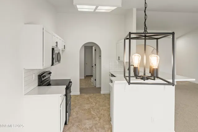a room with a refrigerator a washer and dryer