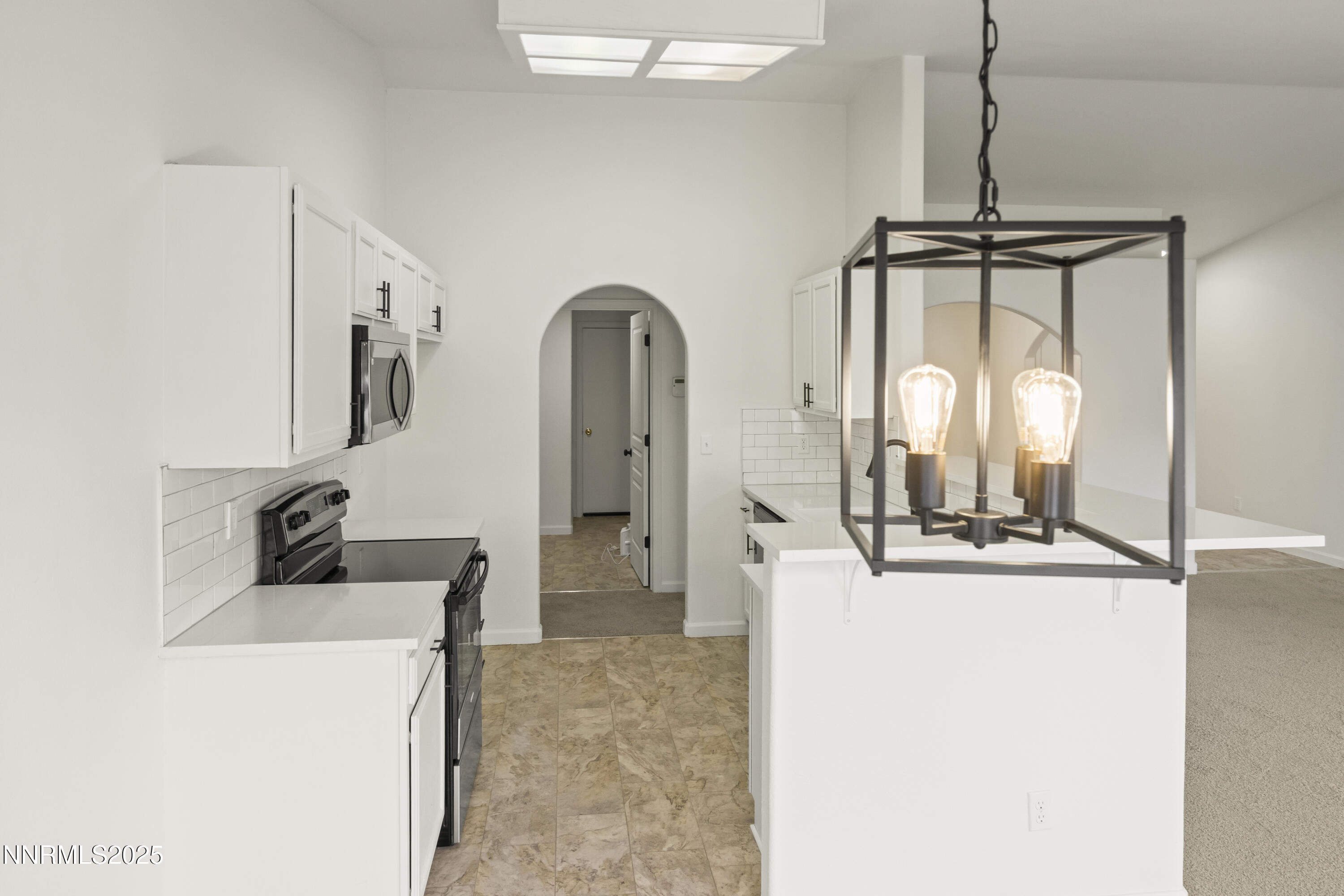 1418 Red Bluffs Way Fernley, NV 89408 - Photo 9 of 35 a room with a refrigerator a washer and dryer