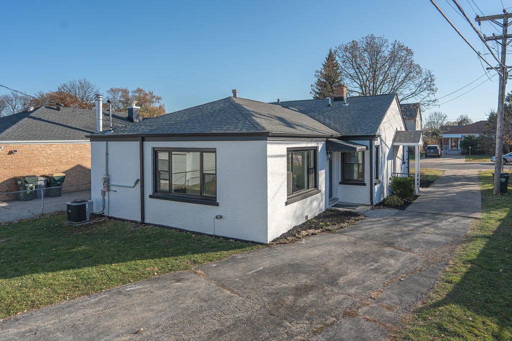 6964 West Cleveland Street Niles, IL 60714 - Photo 18 of 18 a view of a house with a yard