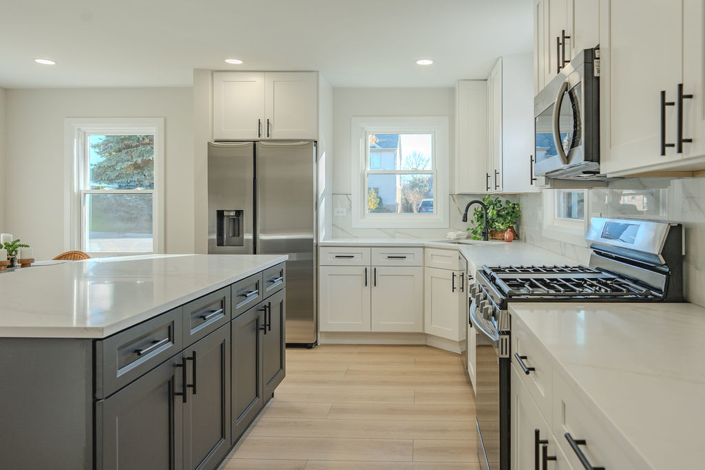 6964 West Cleveland Street Niles, IL 60714 - Photo 3 of 18 a kitchen with granite countertop a sink stove and refrigerator