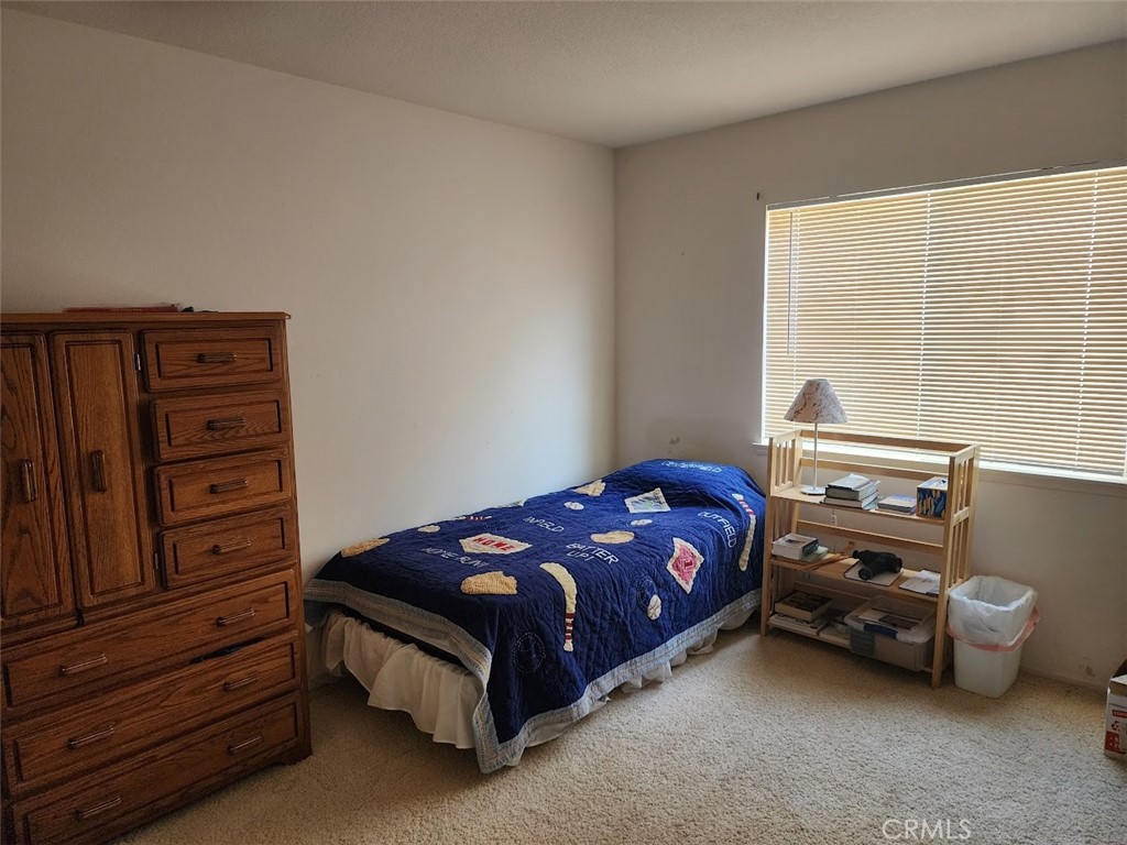 9 Calais Irvine, CA 92602 - Photo 13 of 21 a bedroom with a bed and a dresser