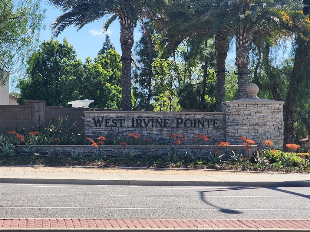 9 Calais Irvine, CA 92602 - Photo 17 of 21 a wooden sign on the side of a building