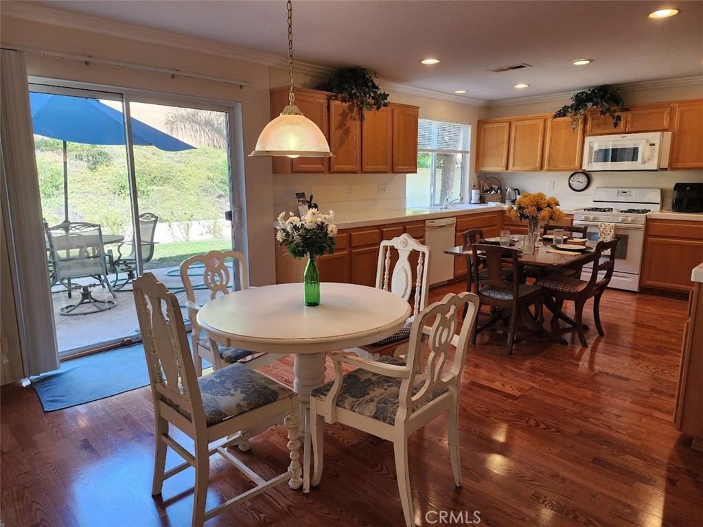 9 Calais Irvine, CA 92602 - Photo 3 of 21 a view of a dining room with furniture window and wooden floor