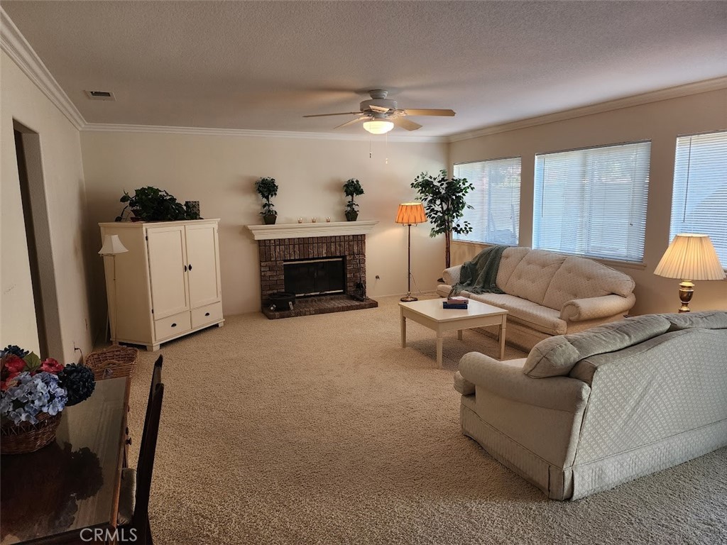 9 Calais Irvine, CA 92602 - Photo 7 of 21 a living room with furniture and a fireplace