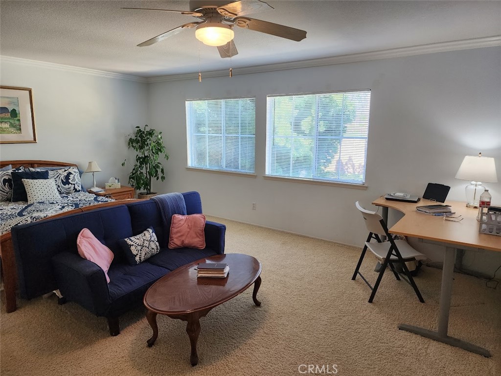 9 Calais Irvine, CA 92602 - Photo 9 of 21 a living room with furniture and a potted plant