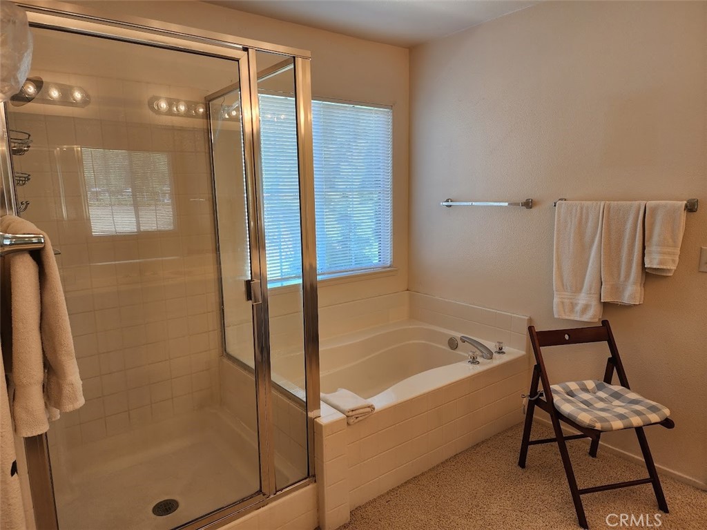 9 Calais Irvine, CA 92602 - Photo 10 of 21 a bathroom with a bathtub and a shower