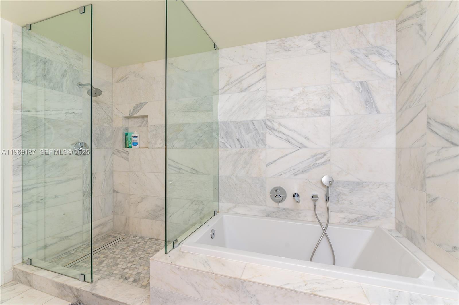 401 North Birch Road, Unit 502 Fort Lauderdale, FL 33304 - Photo 15 of 52 a bathroom with a bathtub and shower