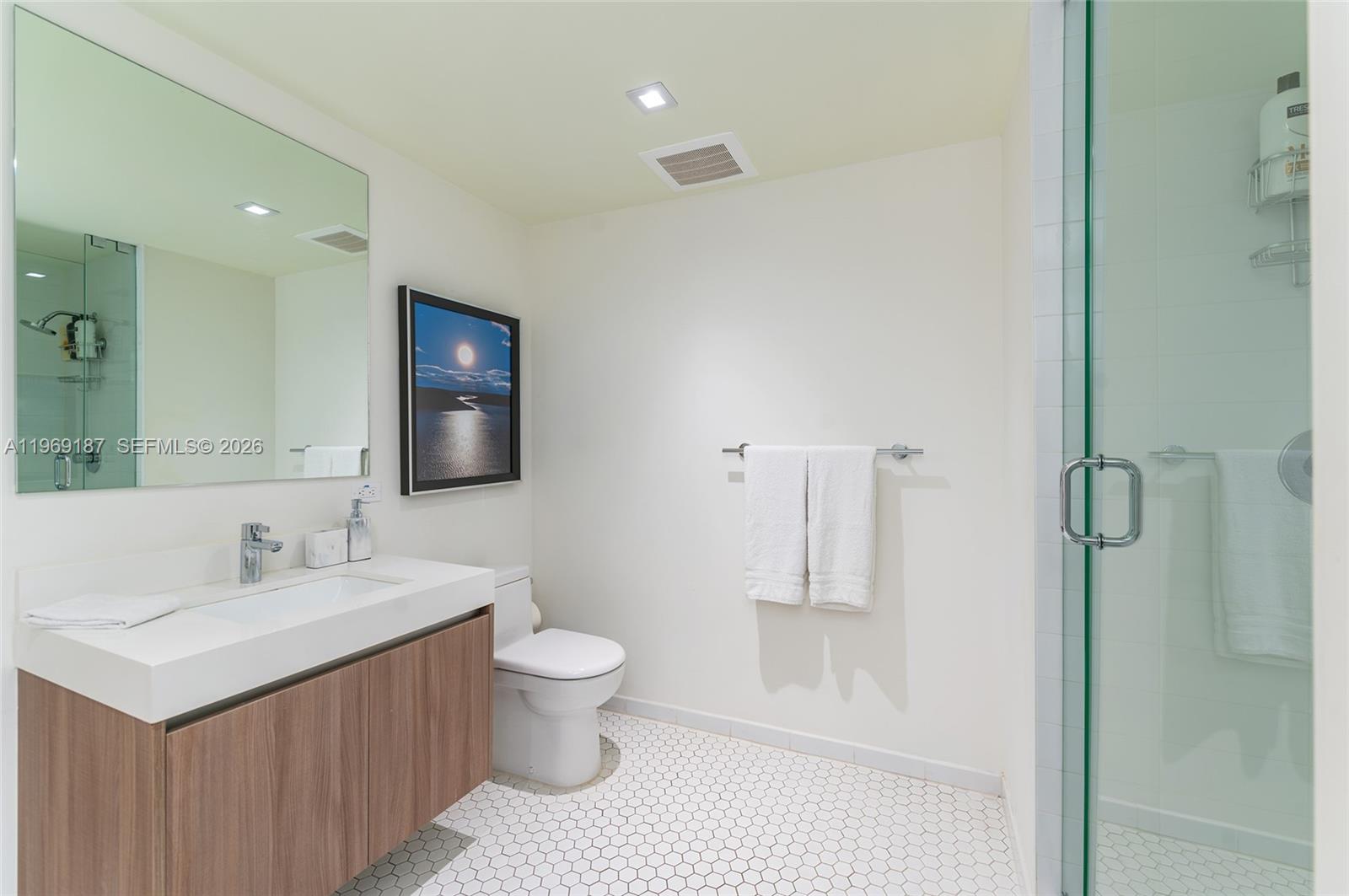 401 North Birch Road, Unit 502 Fort Lauderdale, FL 33304 - Photo 18 of 52 a bathroom with a sink toilet and shower
