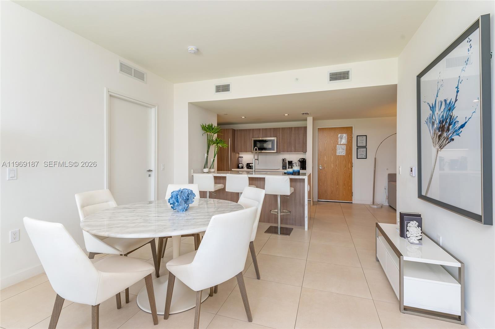 401 North Birch Road, Unit 502 Fort Lauderdale, FL 33304 - Photo 2 of 52 a view of a dining room with furniture