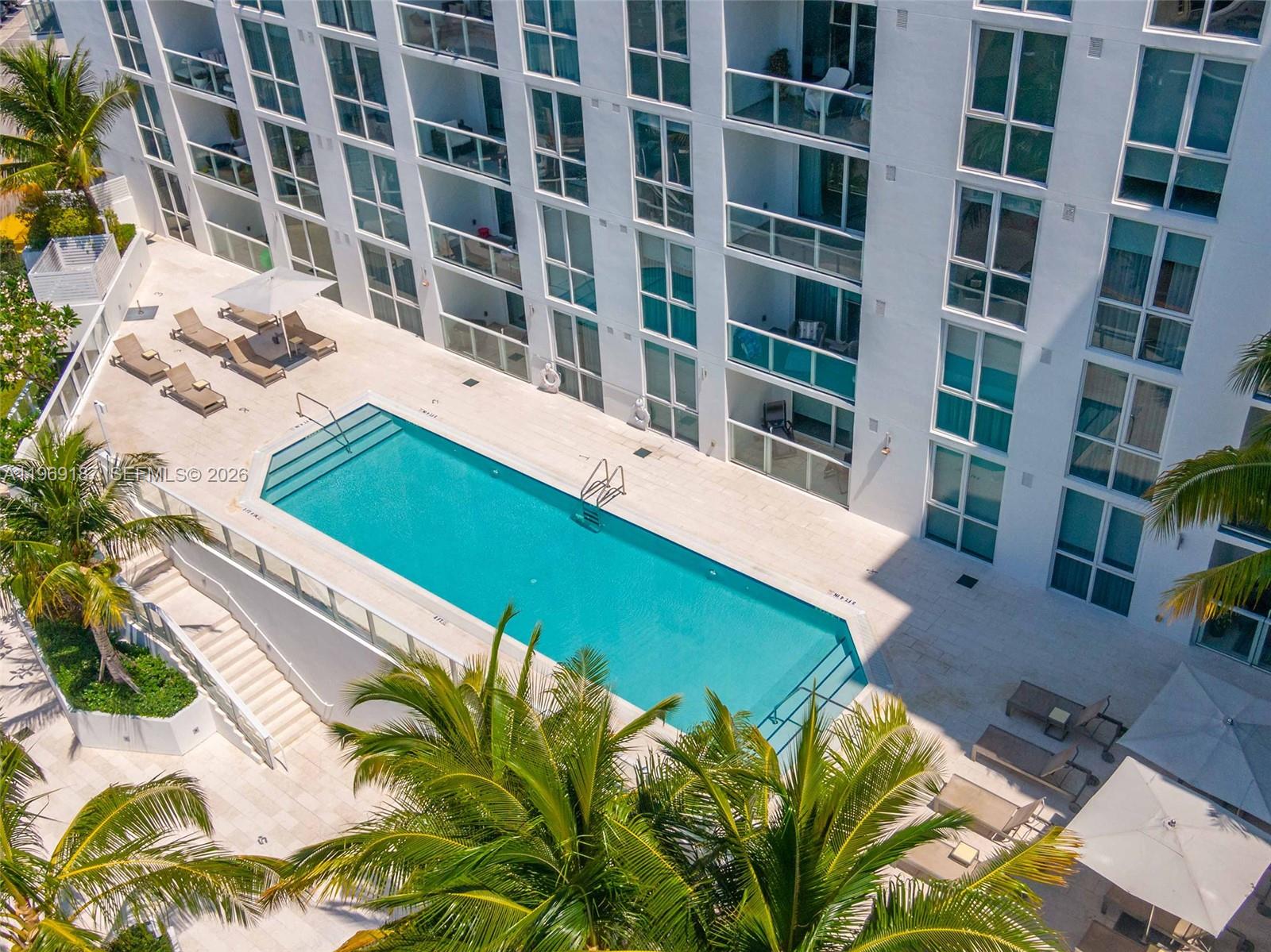 401 North Birch Road, Unit 502 Fort Lauderdale, FL 33304 - Photo 40 of 52 a view of a swimming pool with a patio