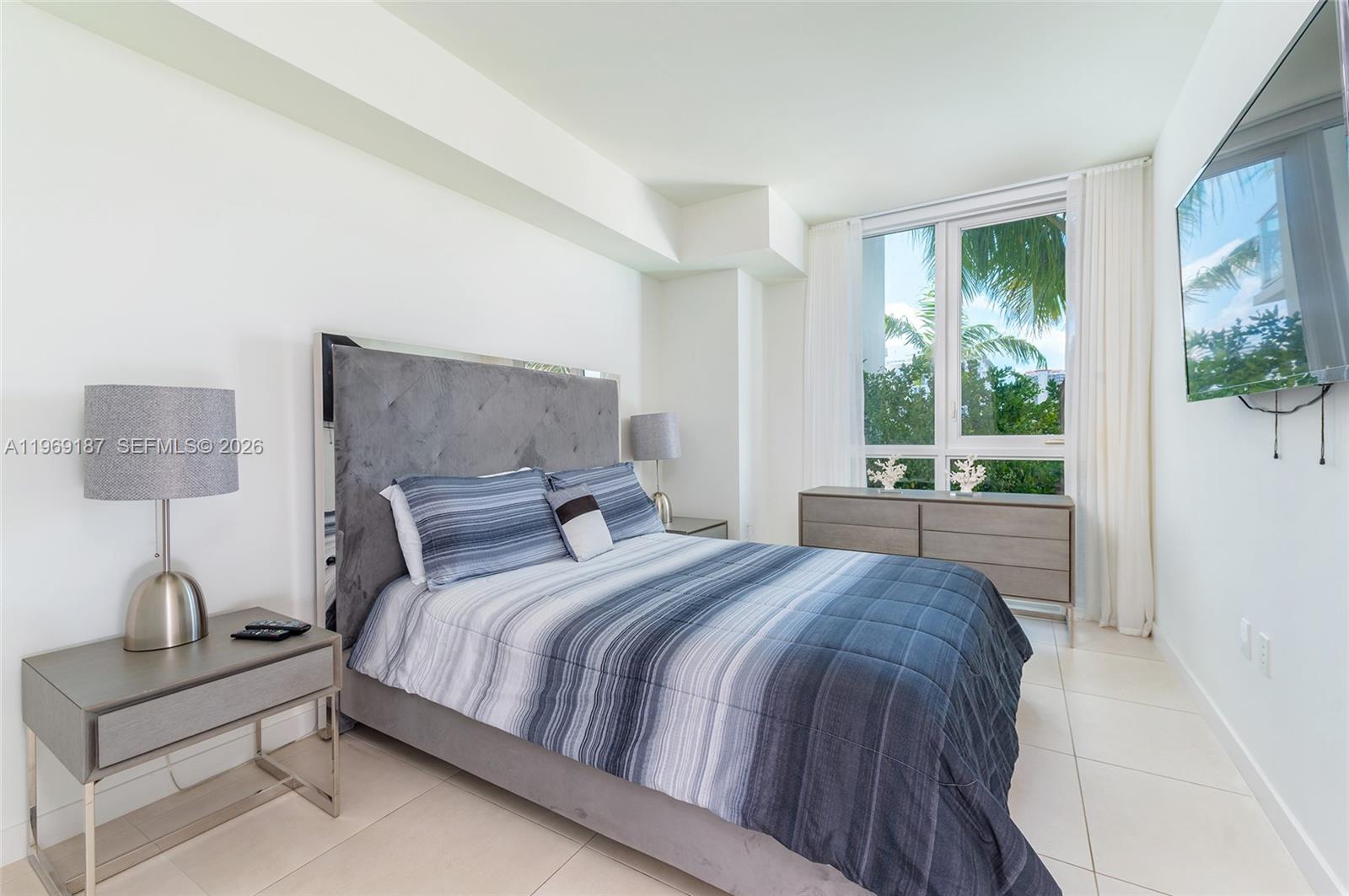 401 North Birch Road, Unit 502 Fort Lauderdale, FL 33304 - Photo 9 of 52 a bedroom with a bed and a window