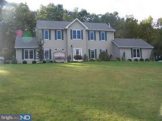 1408 Fels Road Quakertown, PA 18951 - Photo 1 of 6 a front view of a house with a garden and trees