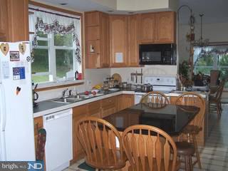 1408 Fels Road Quakertown, PA 18951 - Photo 2 of 6 a kitchen with granite countertop a sink a stove and cabinets