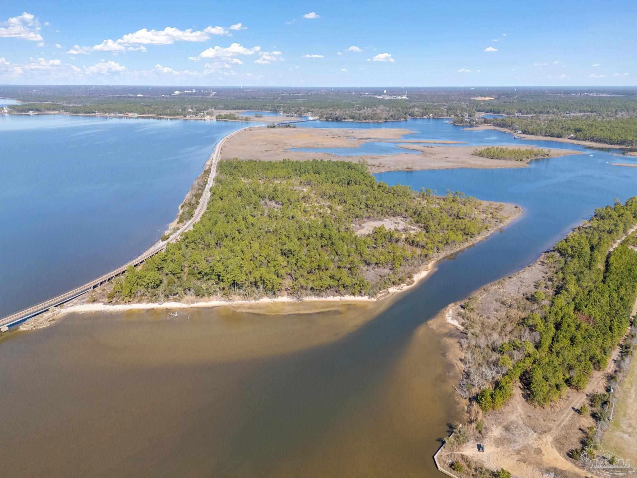 Island Del Monte Street Milton, FL 32583 - Photo 2 of 12 a view of a lake from a balcony