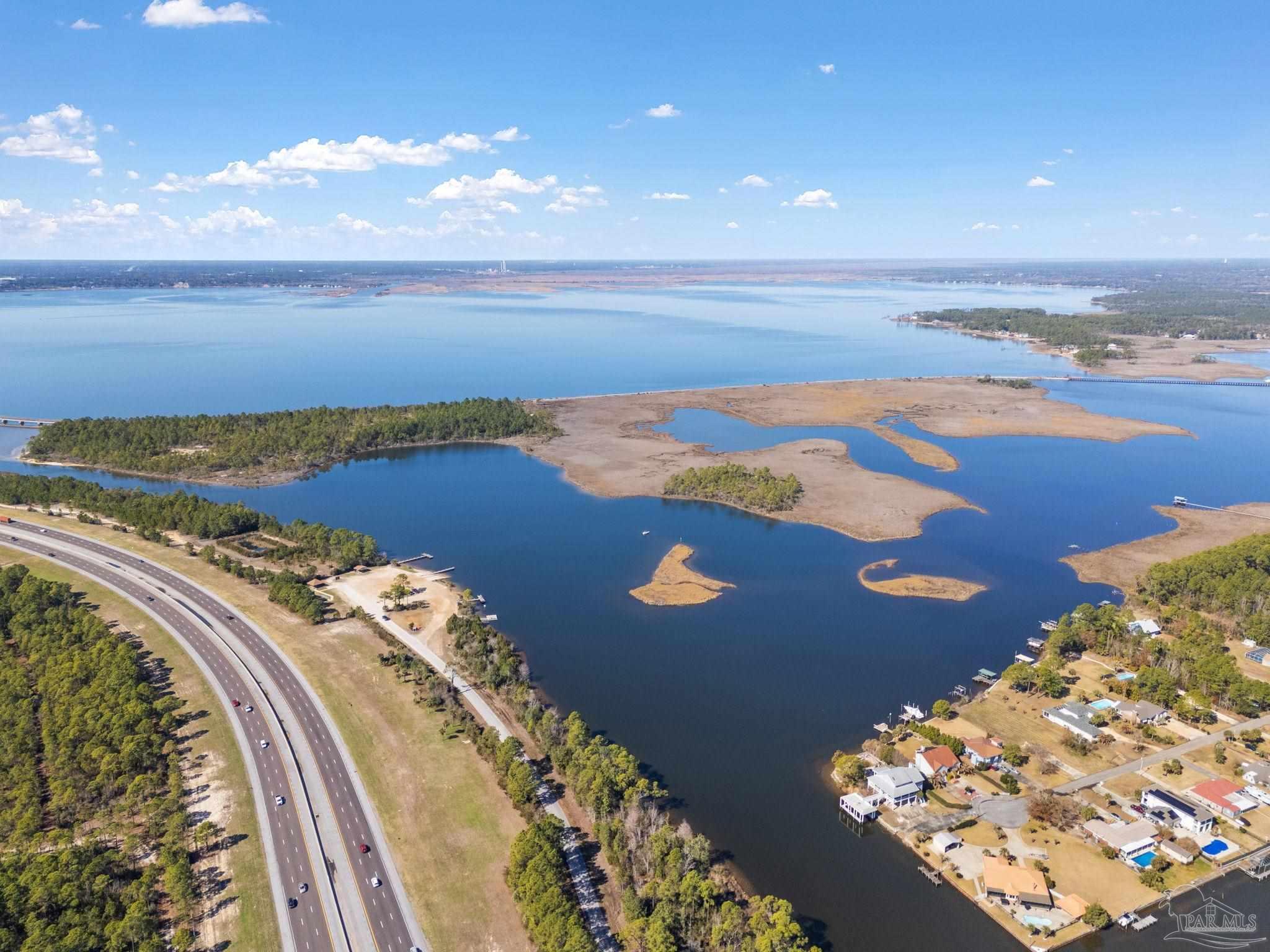 Island Del Monte Street Milton, FL 32583 - Photo 5 of 12 an aerial view of beach and city