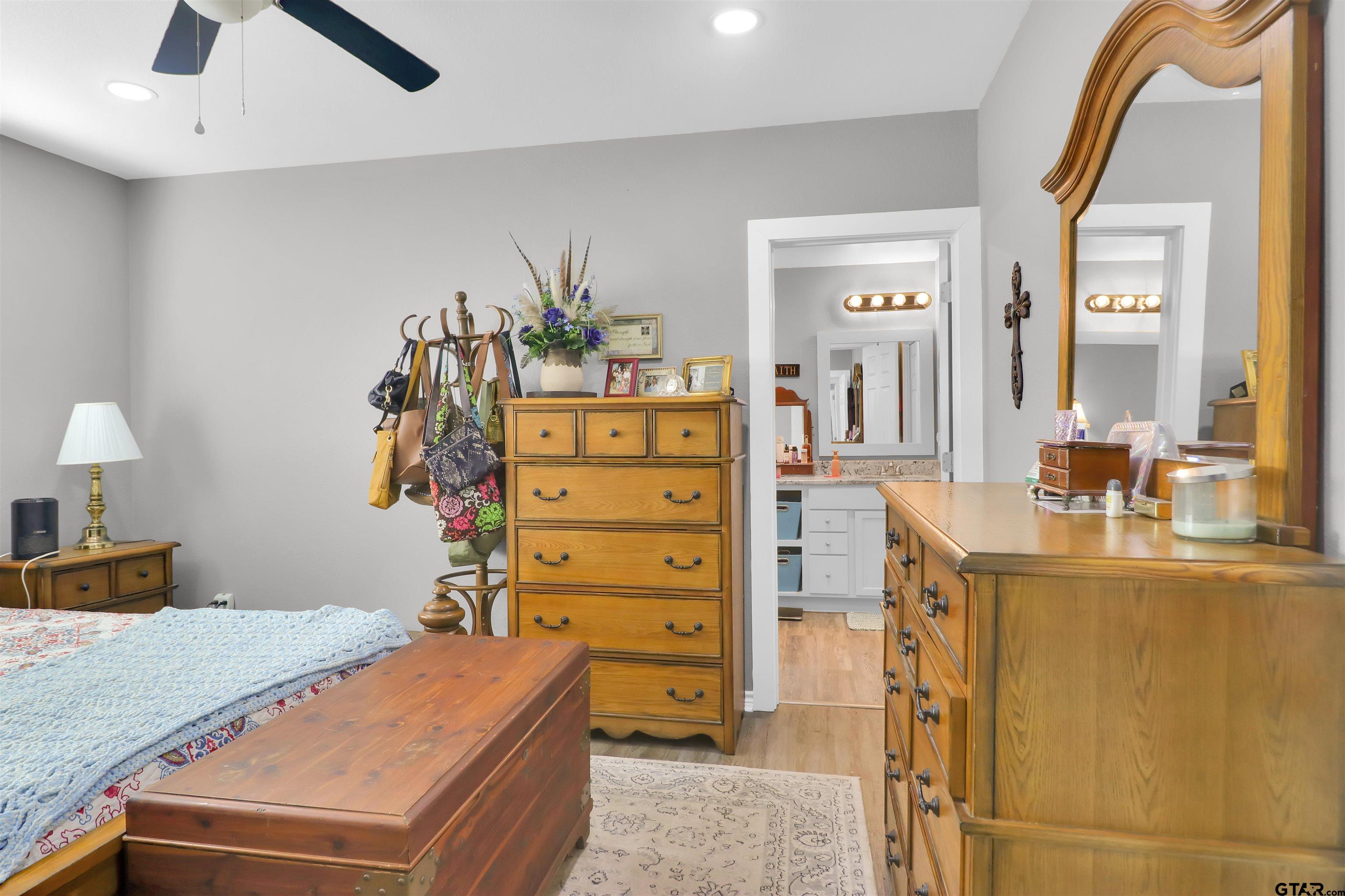 554 East San Antonio Street Alto, TX 75925 - Photo 21 of 28 a bedroom with a bed and a dresser