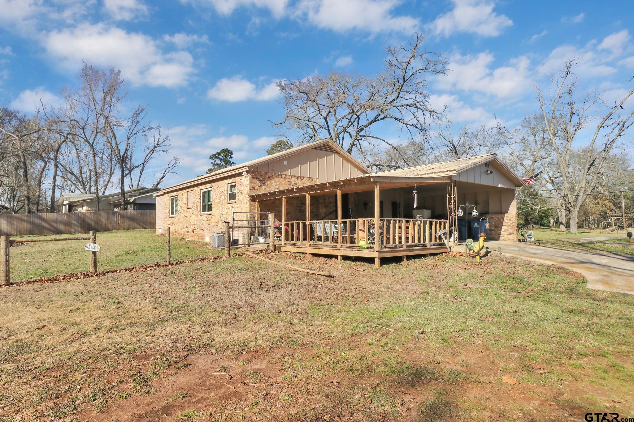 554 East San Antonio Street Alto, TX 75925 - Photo 25 of 28 a view of house with a yard