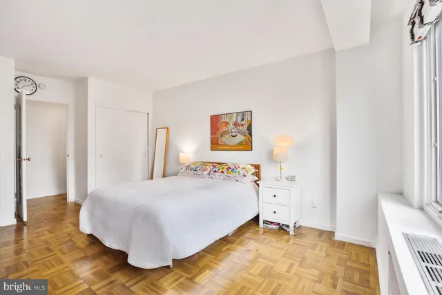 a bedroom with a bed and a cabinets