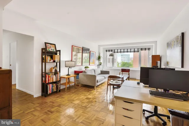 a workspace with furniture and a window