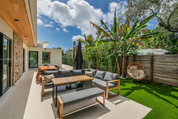 a view of swimming pool with a lounge chairs