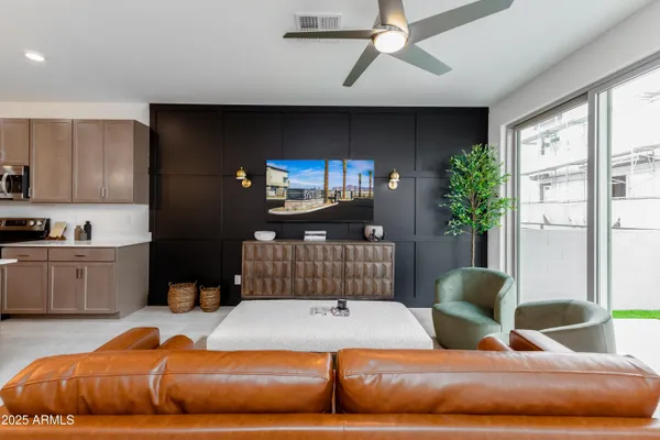 a bedroom with a bed window and potted plant