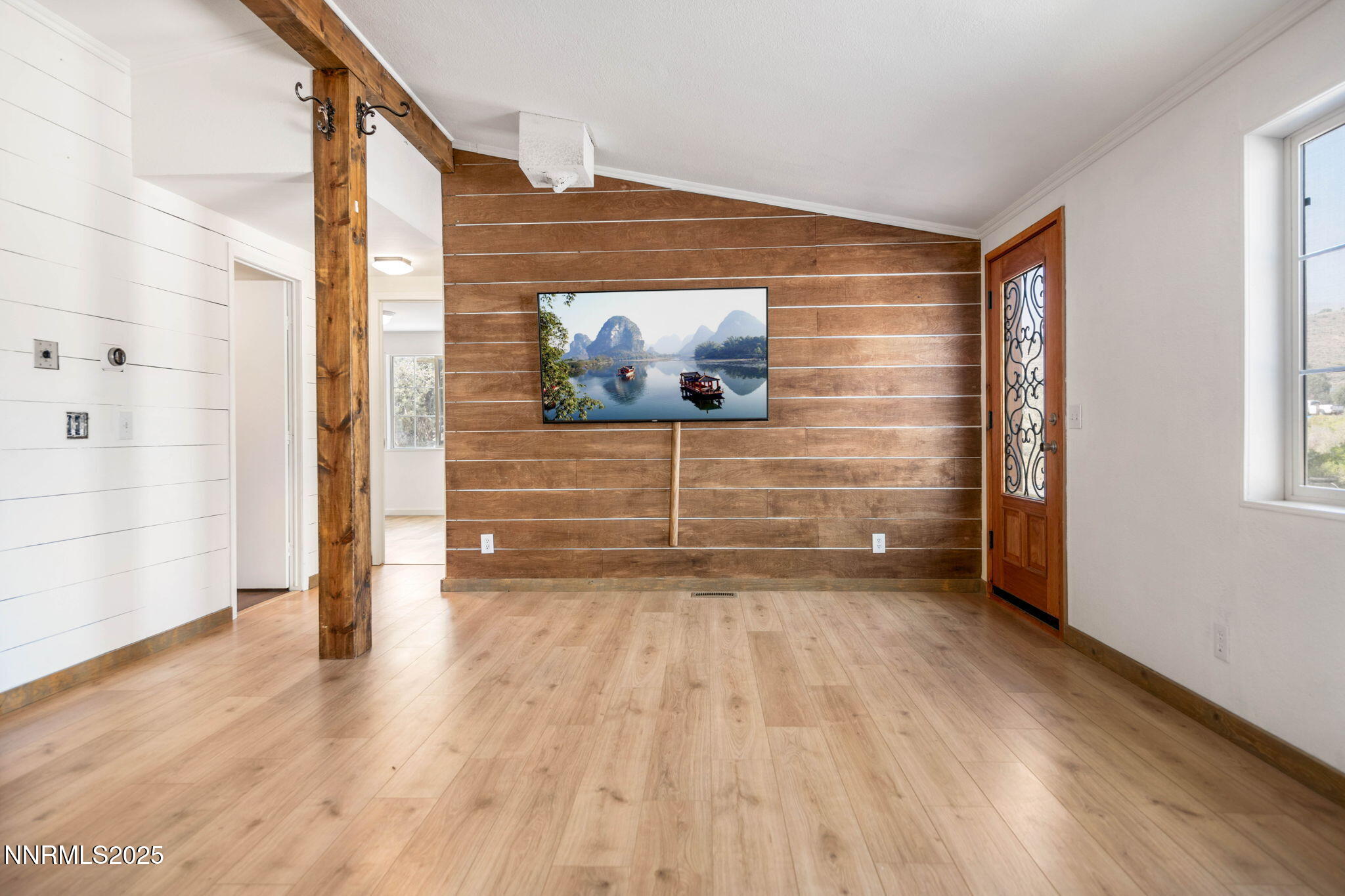 1535 Topaz Ranch Drive Topaz Ranch Estates, NV 89444 - Photo 11 of 38 a view of an empty room with wooden floor and a window
