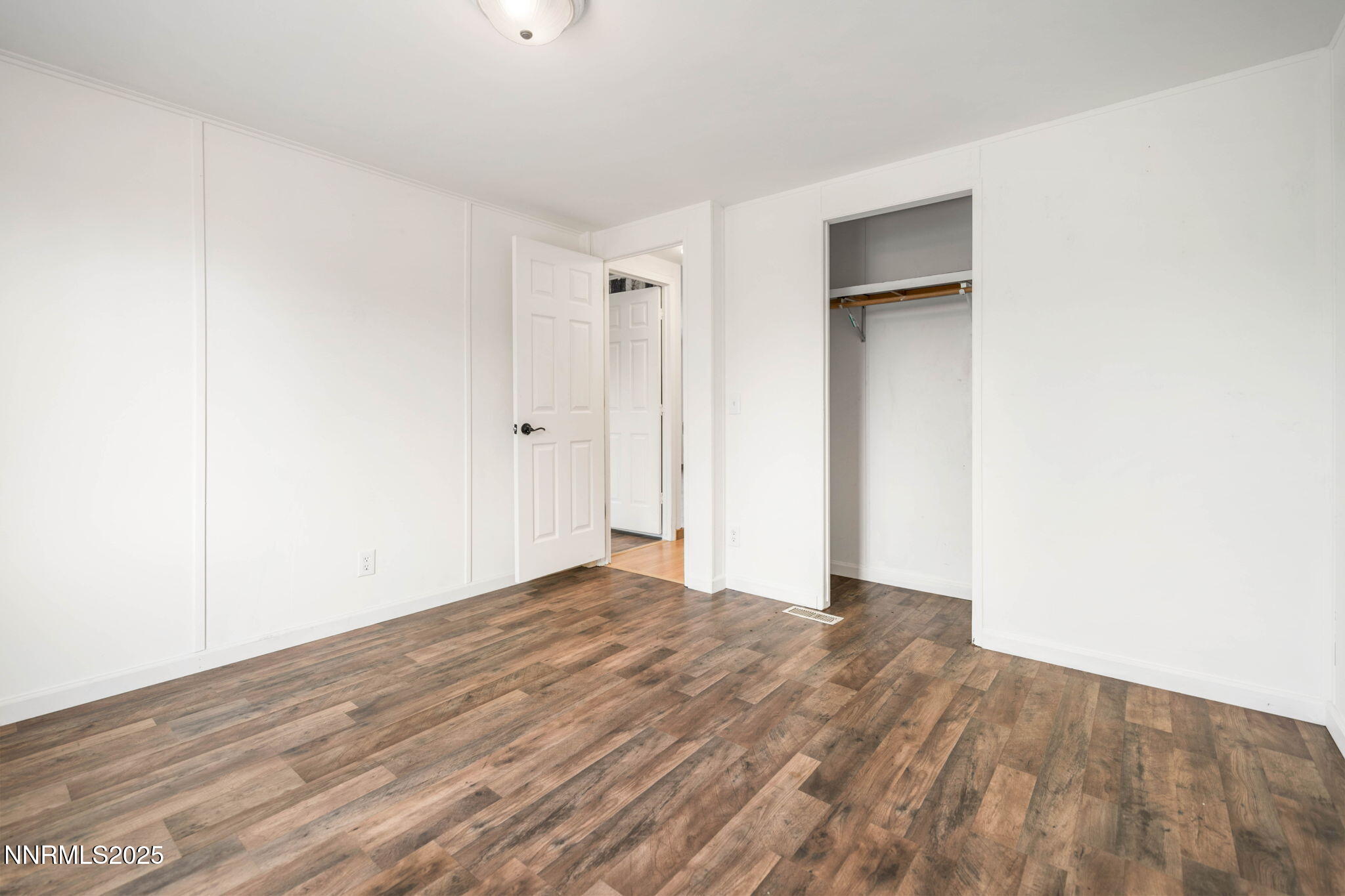 1535 Topaz Ranch Drive Topaz Ranch Estates, NV 89444 - Photo 18 of 38 a view of an empty room with wooden floor