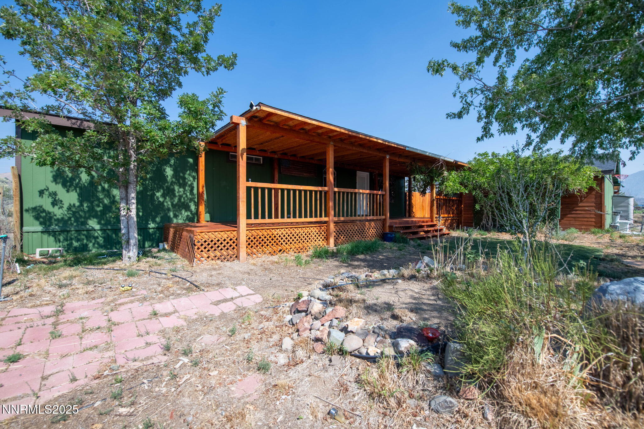 1535 Topaz Ranch Drive Topaz Ranch Estates, NV 89444 - Photo 20 of 38 a view of a house with a yard and wooden fence