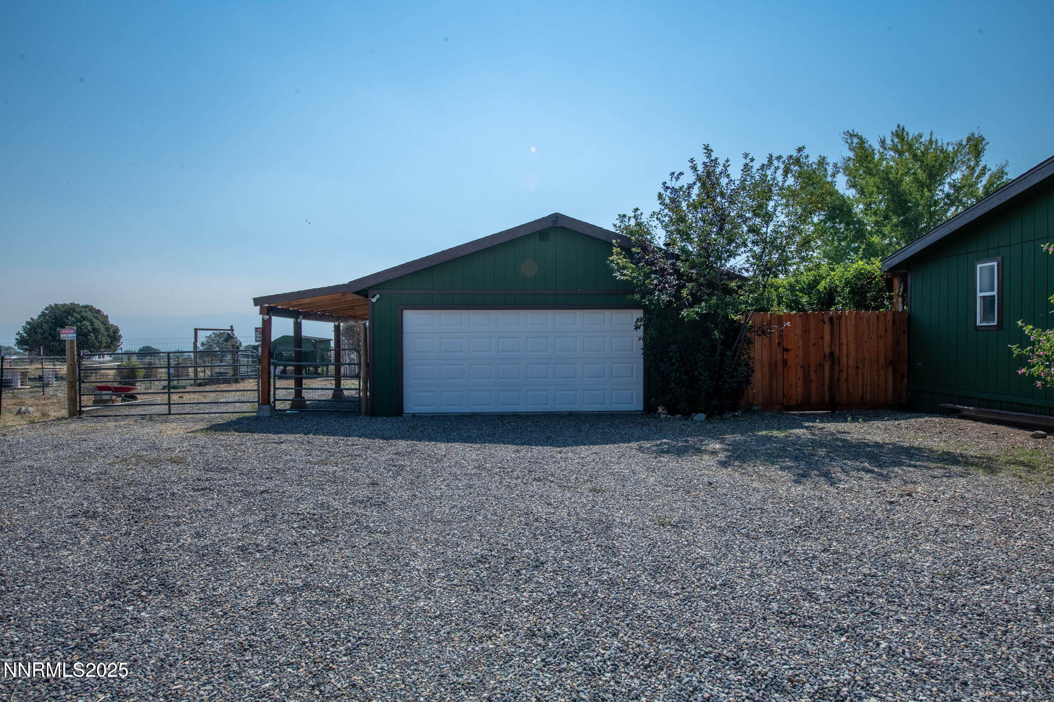 1535 Topaz Ranch Drive Topaz Ranch Estates, NV 89444 - Photo 24 of 38 a front view of a house with a yard and garage