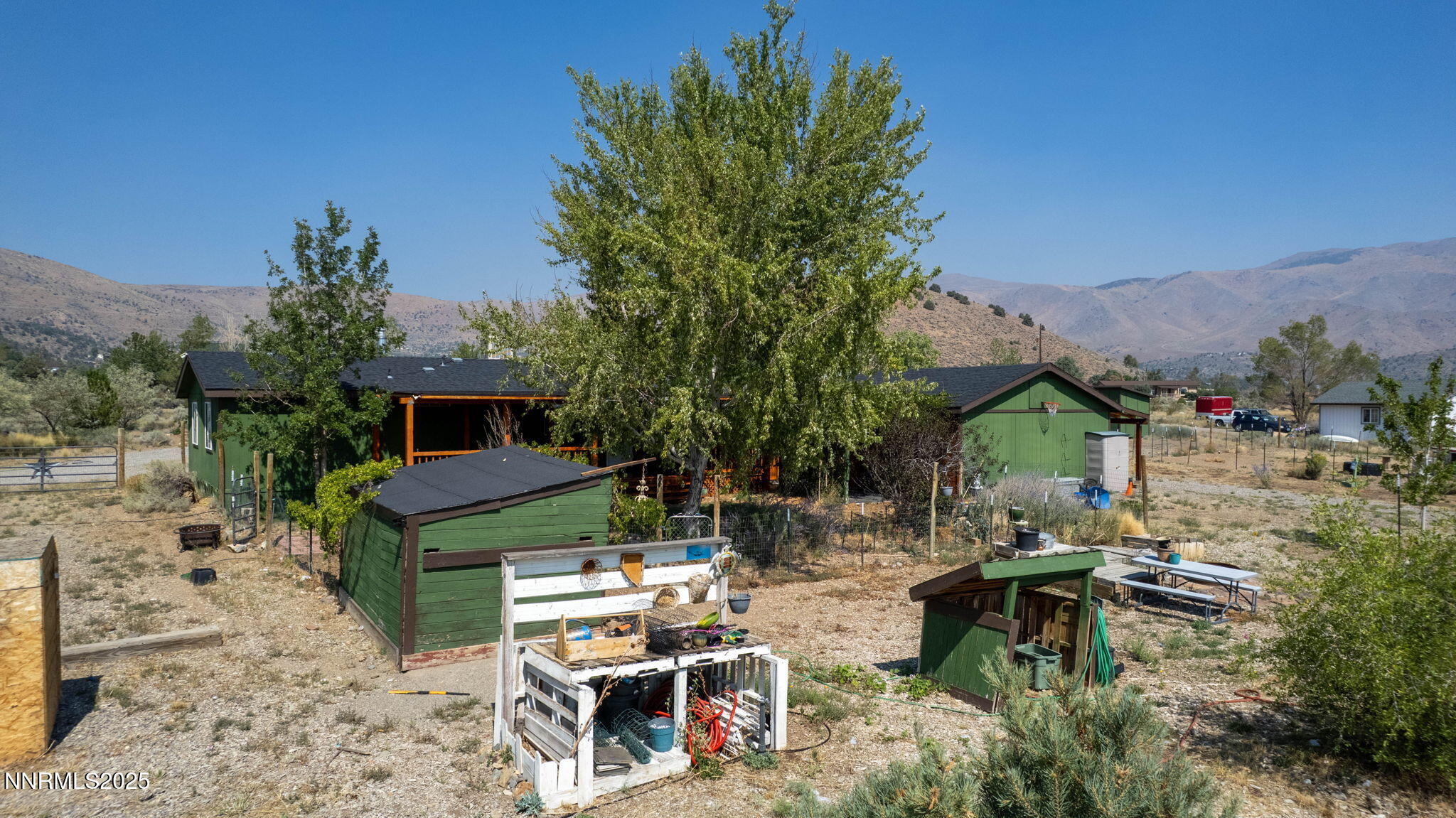 1535 Topaz Ranch Drive Topaz Ranch Estates, NV 89444 - Photo 27 of 38 a view of backyard with outdoor seating a patio and plants