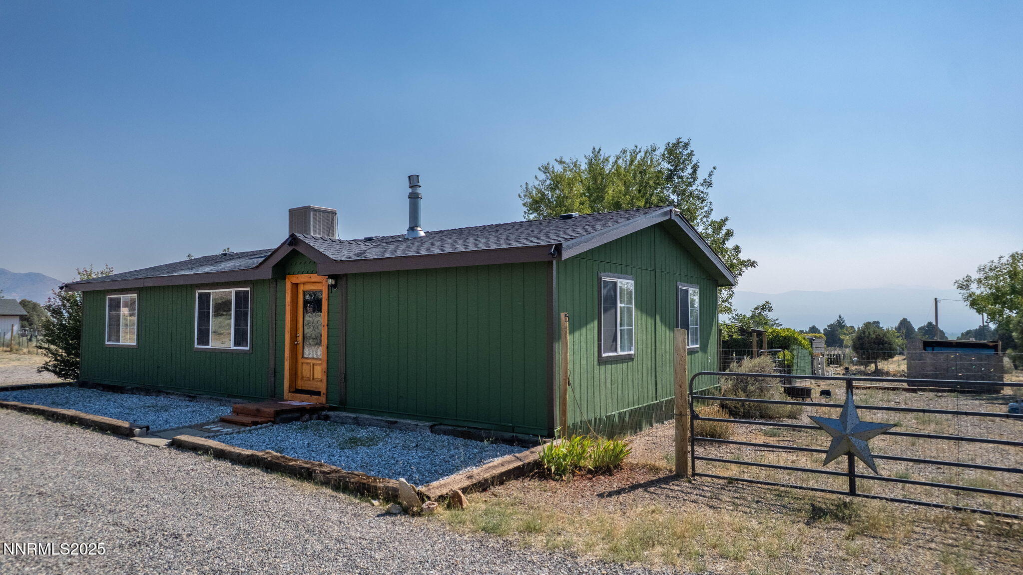 1535 Topaz Ranch Drive Topaz Ranch Estates, NV 89444 - Photo 3 of 38 a view of a house with a backyard