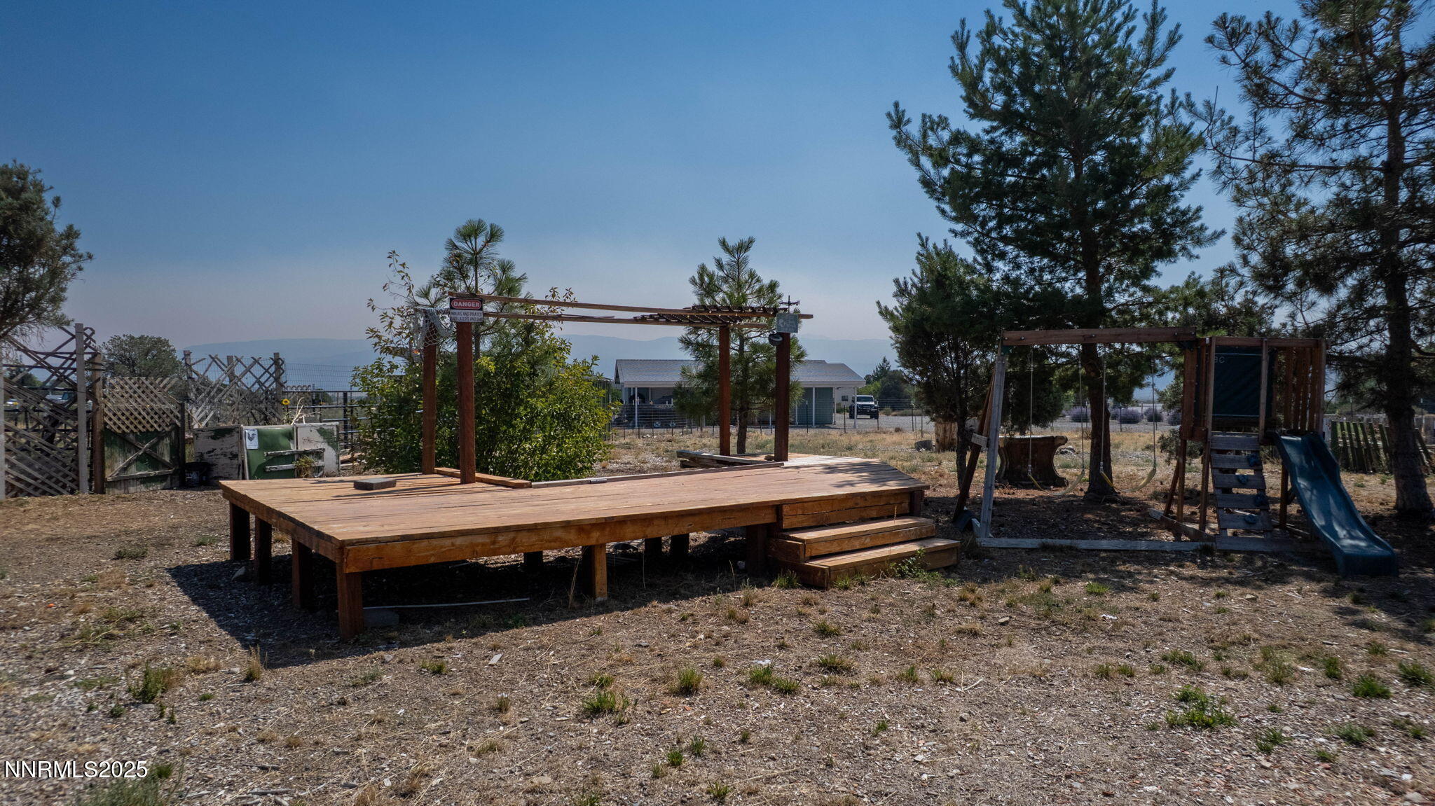 1535 Topaz Ranch Drive Topaz Ranch Estates, NV 89444 - Photo 33 of 38 a view of a sitting area with furniture and wooden fence