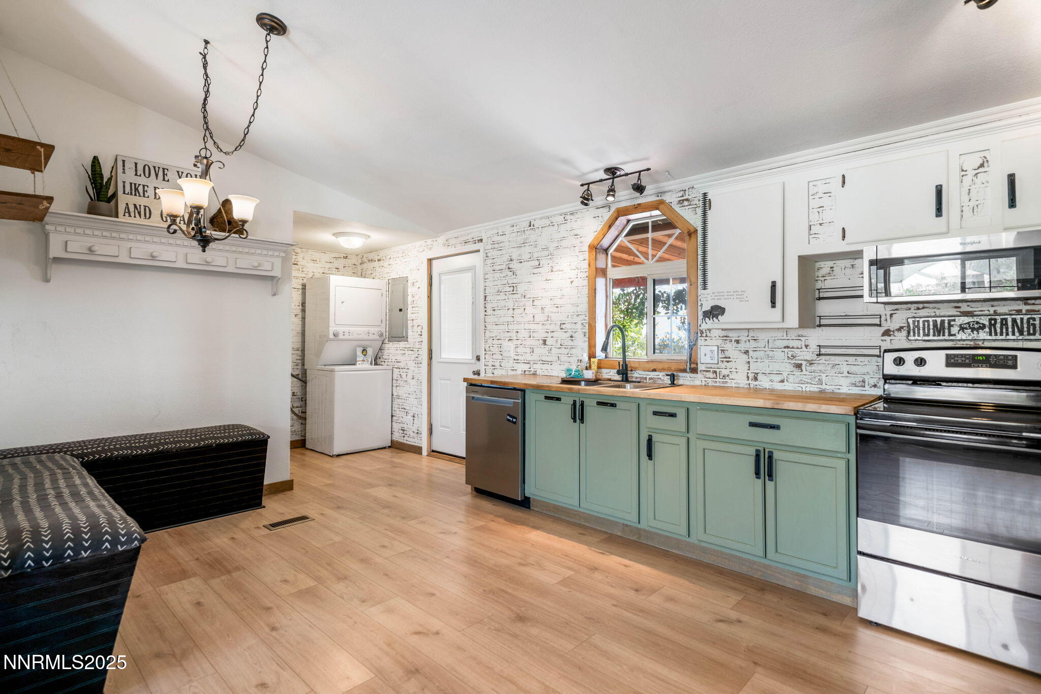 1535 Topaz Ranch Drive Topaz Ranch Estates, NV 89444 - Photo 9 of 38 a kitchen with kitchen island granite countertop a sink cabinets and stainless steel appliances