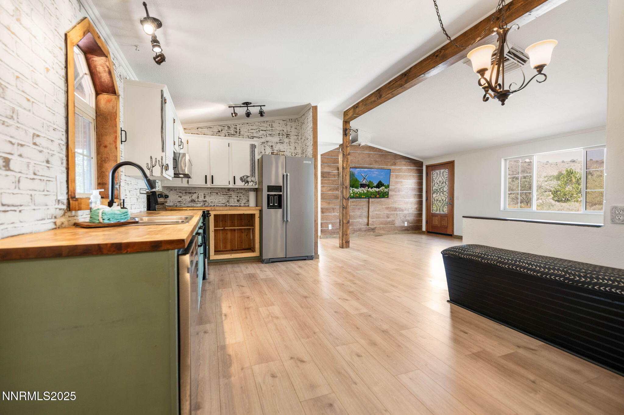 1535 Topaz Ranch Drive Topaz Ranch Estates, NV 89444 - Photo 10 of 38 a kitchen with stainless steel appliances granite countertop a stove a sink dishwasher and a refrigerator with wooden floor